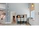 Open wet bar featuring white cabinetry, sleek countertops, and modern barstool seating at 931 Gulf Blvd, Belleair Beach, FL 33786