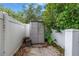 Enclosed area featuring a shed and privacy fence at 9674 104Th Ave, Largo, FL 33773