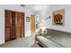 Spare bedroom featuring a futon couch, closet, and unique nautical-themed artwork at 9674 104Th Ave, Largo, FL 33773