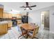 Bright eat-in kitchen featuring modern appliances, light-colored cabinets, and a casual dining table at 9674 104Th Ave, Largo, FL 33773
