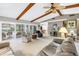 Inviting living area featuring carpeted floors, exposed beams, and plenty of natural light at 9674 104Th Ave, Largo, FL 33773