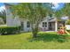 Large backyard featuring playset, grill, patio, and screened-in porch at 10833 Breaking Rocks Dr, Tampa, FL 33647