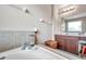 Elegant bathroom featuring a separate shower and a luxurious soaking tub with tile surround at 10833 Breaking Rocks Dr, Tampa, FL 33647