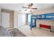 Bedroom featuring a blue bunk bed with a basketball hoop and a futon at 10833 Breaking Rocks Dr, Tampa, FL 33647