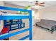 Unique bedroom with bunk beds, futon, and playful decor; ideal for or guests at 10833 Breaking Rocks Dr, Tampa, FL 33647