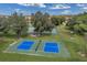 Aerial view of community park featuring pickleball court and basketball court at 10833 Breaking Rocks Dr, Tampa, FL 33647