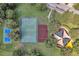 Aerial view of community park featuring basketball and playground at 10833 Breaking Rocks Dr, Tampa, FL 33647
