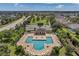 Aerial view of community pool and sundeck with ample seating at 10833 Breaking Rocks Dr, Tampa, FL 33647