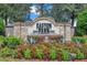 Easton Park: A deed-restricted community entrance sign surrounded by colorful landscaping at 10833 Breaking Rocks Dr, Tampa, FL 33647
