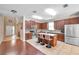 Spacious kitchen with stainless steel appliances, island with seating, and rich wood cabinetry at 10833 Breaking Rocks Dr, Tampa, FL 33647