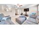 Upper living room with neutral carpet, fan, and comfortable seating arrangement at 10833 Breaking Rocks Dr, Tampa, FL 33647