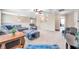 Upper living room with carpet, multiple seating options, and natural lighting at 10833 Breaking Rocks Dr, Tampa, FL 33647