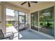 Covered patio with outdoor seating, offering views of the spacious backyard and playset at 10833 Breaking Rocks Dr, Tampa, FL 33647