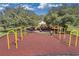 Community playground with swings and play structure, offering a fun and safe recreational area for children at 10833 Breaking Rocks Dr, Tampa, FL 33647