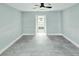 Bedroom featuring tiled floors and a glimpse of a bathroom with double vanities at 1178 Sultana St, Port Charlotte, FL 33952