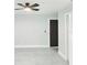 A bedroom with neutral paint, tile floors, and a closet at 1178 Sultana St, Port Charlotte, FL 33952