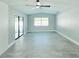 Bedroom featuring tiled floors, a ceiling fan, natural light, and access to the outdoors at 1178 Sultana St, Port Charlotte, FL 33952