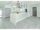 Elegant kitchen with a center island, stainless steel hood, and bright lighting at 1178 Sultana St, Port Charlotte, FL 33952