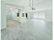 Spacious kitchen with modern island, open layout, and modern lighting fixture at 1178 Sultana St, Port Charlotte, FL 33952