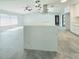 Stylish kitchen island with a stainless steel hood, modern light fixtures, and an open layout at 1178 Sultana St, Port Charlotte, FL 33952