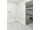 The laundry room features tile flooring, a utility sink and access to a garage at 1178 Sultana St, Port Charlotte, FL 33952