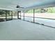 Screened patio offering a view of the private pool, ceiling fan, and a door to the backyard at 1178 Sultana St, Port Charlotte, FL 33952