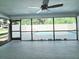 The screened-in patio offers a view of the refreshing pool and landscaped backyard at 1178 Sultana St, Port Charlotte, FL 33952