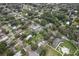 An aerial view displays the neighborhood, nearby park, and surrounding mature trees at 1206 E Frierson Ave # B, Tampa, FL 33603