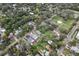 Aerial view showcases the backyard, surrounding trees, and nearby community park at 1206 E Frierson Ave # B, Tampa, FL 33603