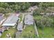 An aerial view displaying the property, fenced backyard, and convenient community park access at 1206 E Frierson Ave # B, Tampa, FL 33603