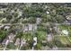 Aerial view showcasing the backyard, surrounding trees, and community park access at 1206 E Frierson Ave # B, Tampa, FL 33603