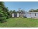 Backyard featuring a shed and plenty of green space with a wooden fence providing privacy at 1206 E Frierson Ave # B, Tampa, FL 33603