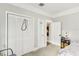 Bedroom featuring two large closets and a view into another room with a decorative lamp at 1206 E Frierson Ave # B, Tampa, FL 33603