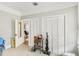 Bright bedroom with a view into another room and featuring two large closets for storage at 1206 E Frierson Ave # B, Tampa, FL 33603