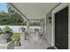 Inviting front porch with seating, planters, and classic architectural details at 1206 E Frierson Ave # B, Tampa, FL 33603