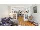 Open-concept living room with hardwood floors and seamless flow into the dining area at 1206 E Frierson Ave # B, Tampa, FL 33603