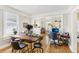 Open living space with hardwood floors connecting dining, living, and office areas at 1206 E Frierson Ave # B, Tampa, FL 33603