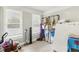 A spare storage room with natural light from two windows and ample space for organizing household items at 1206 E Frierson Ave # B, Tampa, FL 33603