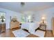 Cozy bedroom featuring hardwood floors, white walls, and natural light from a window with a view at 1210 Wolford Dr, Trinity, FL 34655