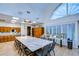 Spacious craft room featuring a large work table, ample storage, and natural light, perfect for creative projects at 1210 Wolford Dr, Trinity, FL 34655
