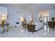 Bright living room featuring tile floors, neutral walls, and ample seating with a seamless flow at 1210 Wolford Dr, Trinity, FL 34655