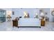 Spacious living room with tile flooring, white sofa and multiple seating options, bright and airy at 1210 Wolford Dr, Trinity, FL 34655