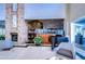 Comfortable lounge area featuring a fireplace, piano, and cozy seating for relaxation and entertainment at 1210 Wolford Dr, Trinity, FL 34655