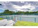 Community tennis court surrounded by lush trees, perfect for enjoying an active outdoor lifestyle at 1210 Wolford Dr, Trinity, FL 34655