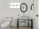 Modern bathroom features an eye-catching vessel sink with a stylish glass vanity at 12222 Meadowbrook Ln, Hudson, FL 34667