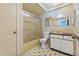 Bathroom features a shower/tub combination and vanity at 12222 Meadowbrook Ln, Hudson, FL 34667