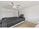 Bedroom features a ceiling fan and neutral carpet flooring at 12222 Meadowbrook Ln, Hudson, FL 34667