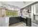 Updated kitchen with granite countertops and backyard view at 12222 Meadowbrook Ln, Hudson, FL 34667