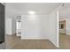 Bright living room features light wood flooring and a painted brick accent wall at 12222 Meadowbrook Ln, Hudson, FL 34667