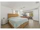 Comfortable main bedroom boasts sliding glass door access to the outdoor patio at 12222 Meadowbrook Ln, Hudson, FL 34667